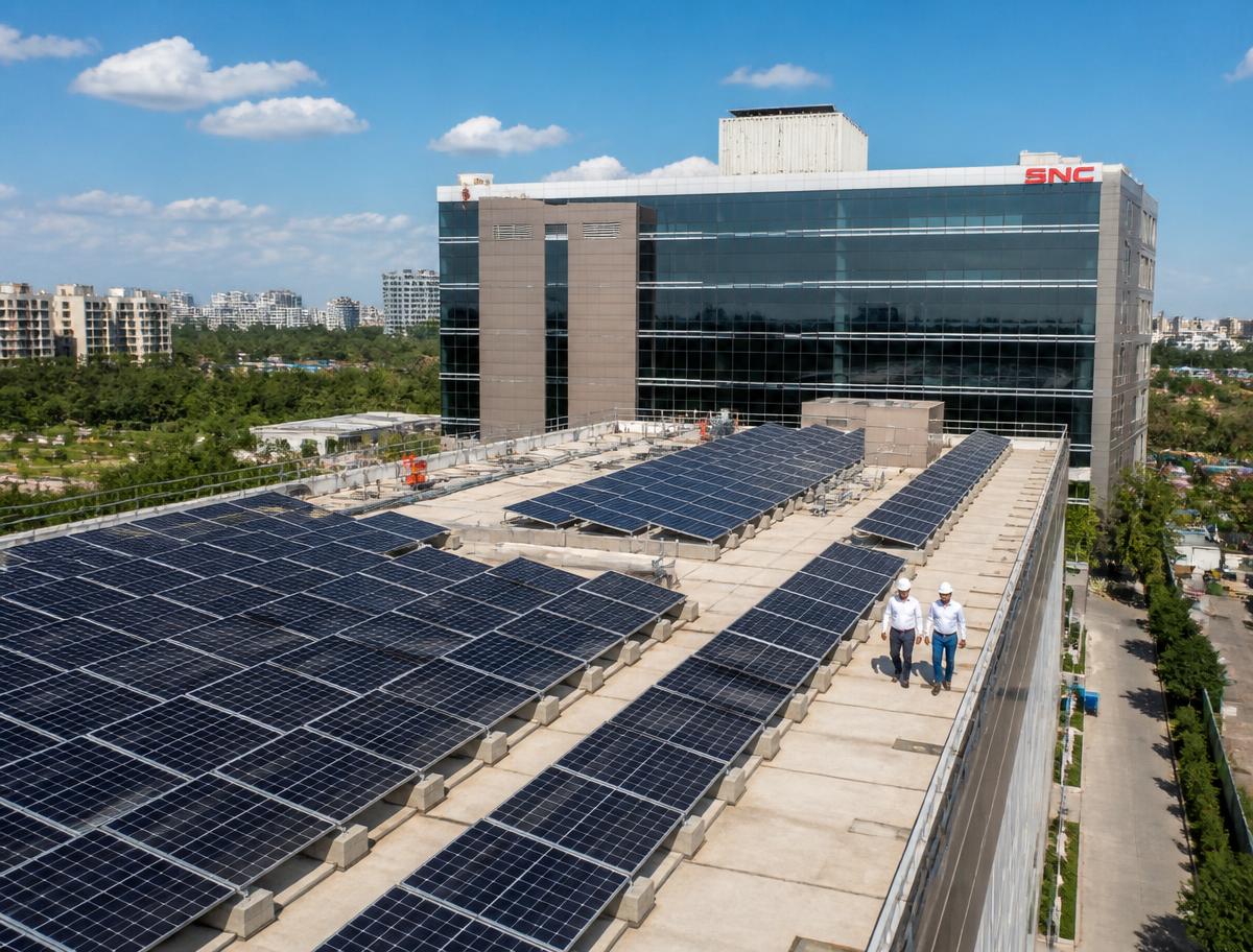 Commercial office building rooftop covered with solar panels