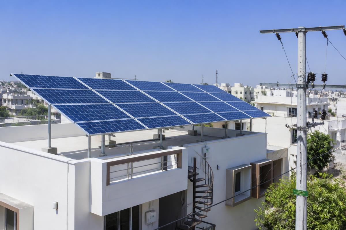 Rooftop solar panels on a modern Indian home connected to the electricity grid